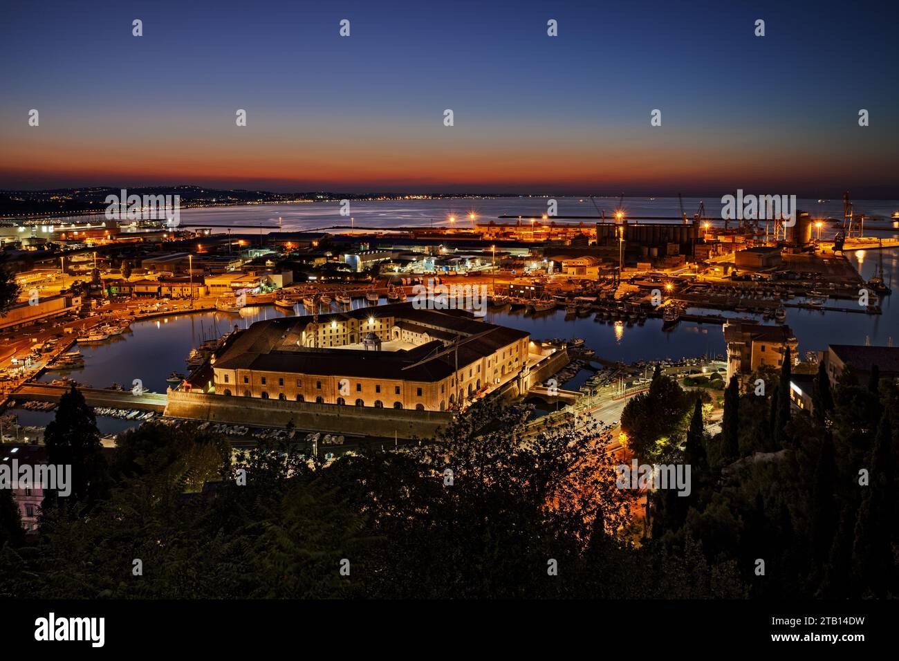 Ancona, Marche, Italy: night landscape of the sheltered port for the small boats and fishing vessels with the pentagonal Mole Vanvitelliana, built on Stock Photo