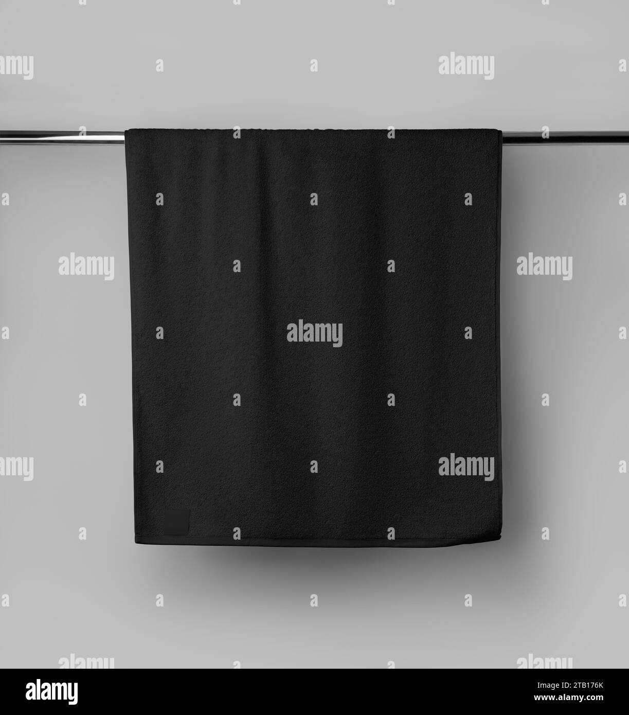 Terry black towel template with a label on a metal tube, hanging