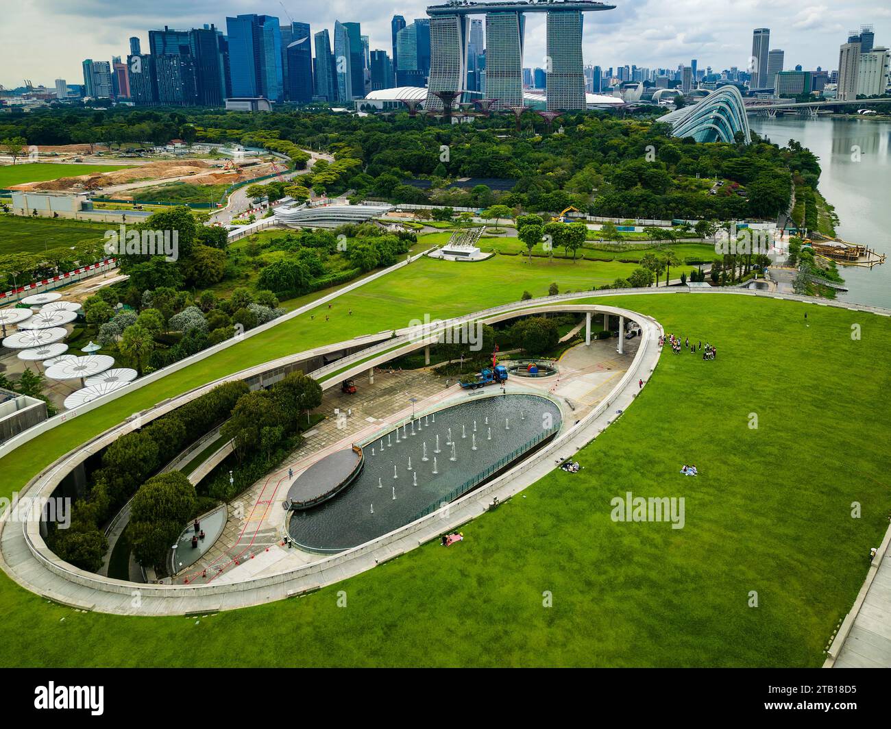 Aerial view of the grass rooftop garden of the Marina Barrage overlooking the Marina Bay area of Singapore Stock Photo