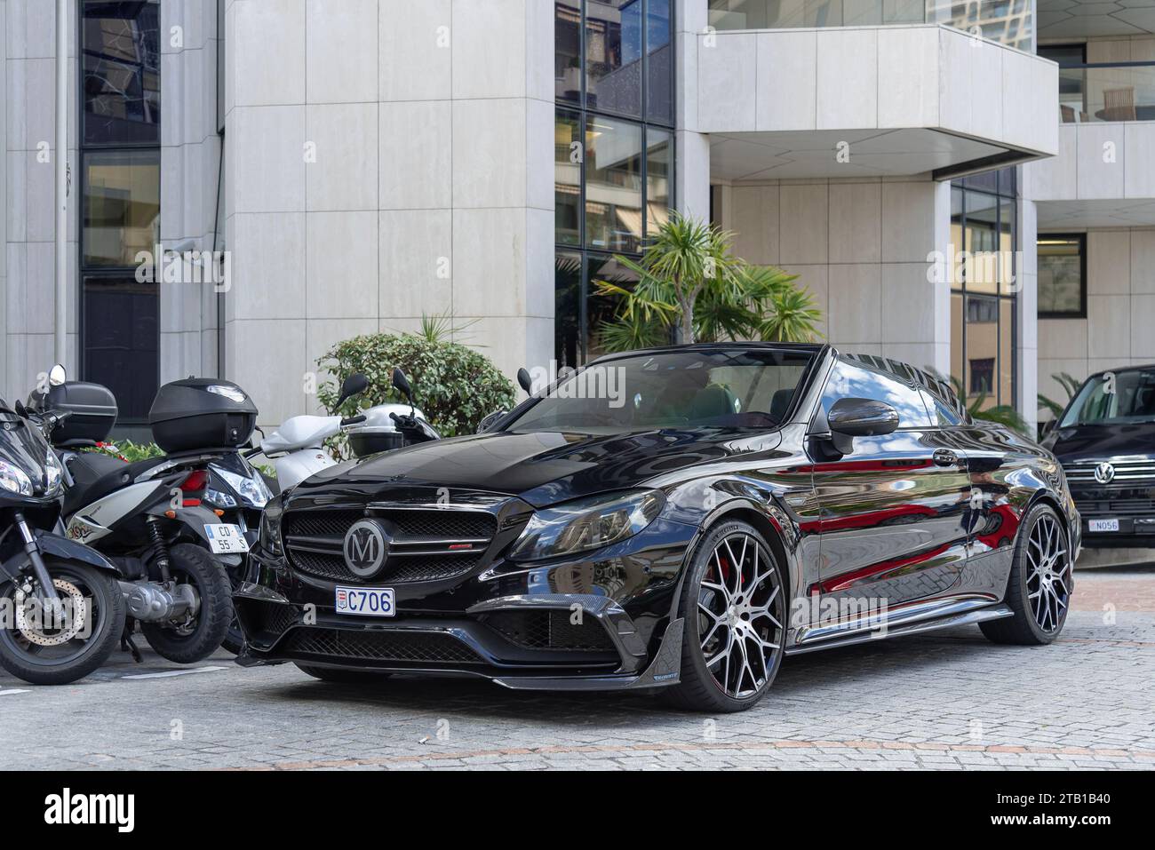 Monaco, Monaco - Black Mercedes-AMG Mansory C 63 S Convertible parked in a street. Stock Photo