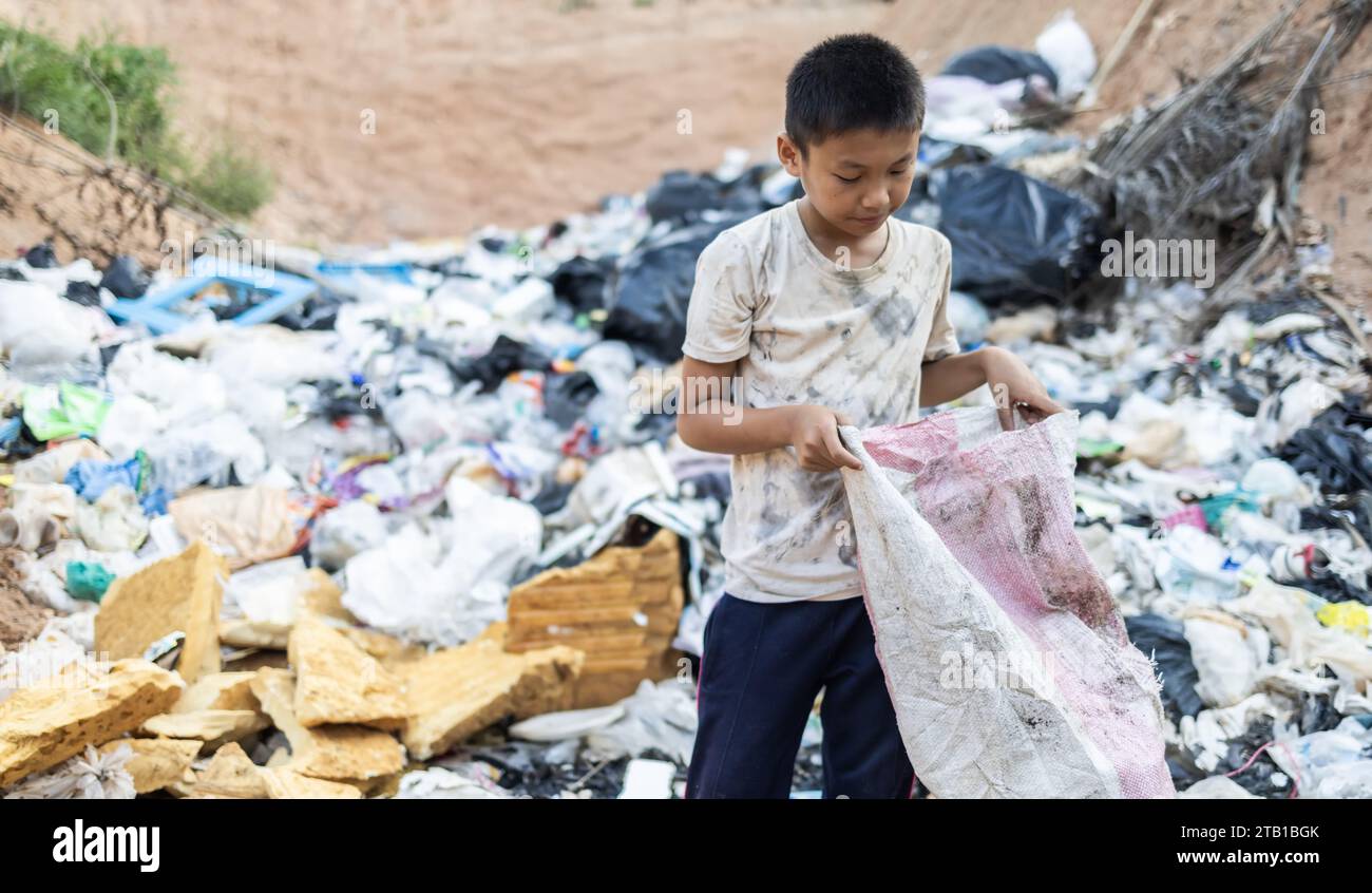 Poor children on the garbage dump and selecting plastic waste to sell ...