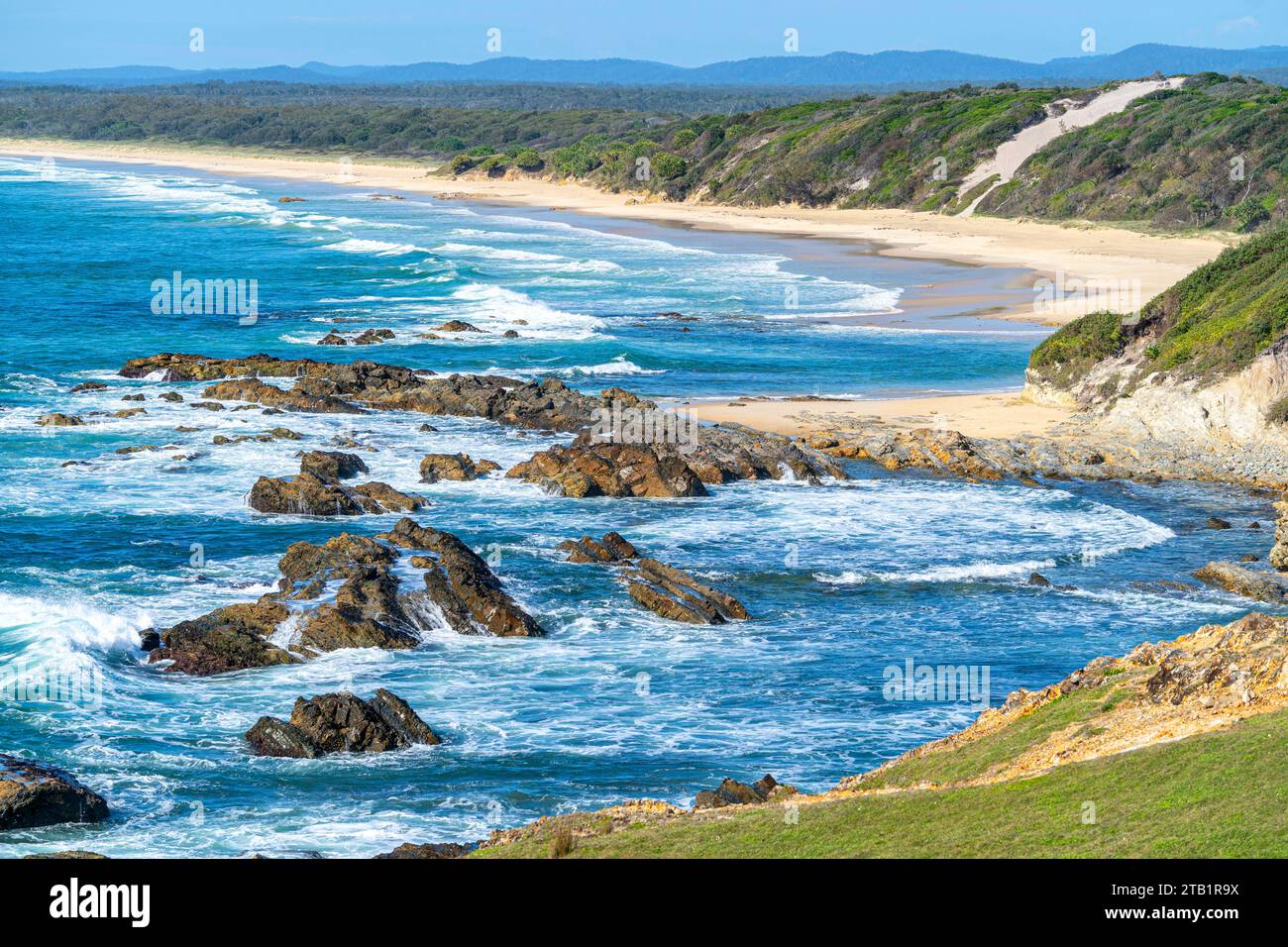 Sandy beach, part of Yuraygir Coastal Walk stretching south from Brooms Head NSW Stock Photo