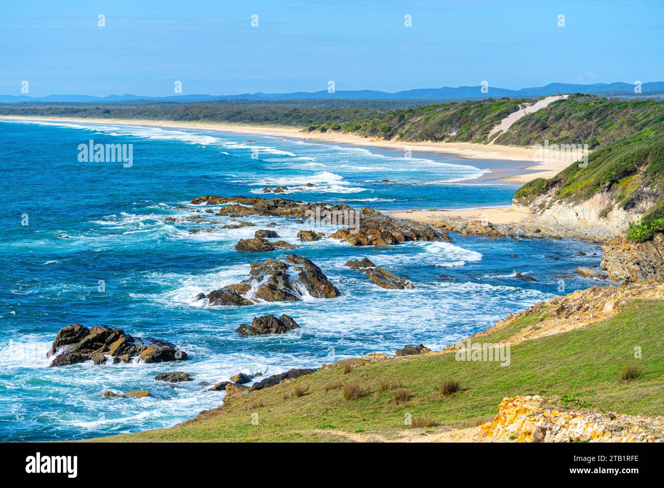Sandy beach, part of Yuraygir Coastal Walk stretching south from Brooms Head NSW Stock Photo