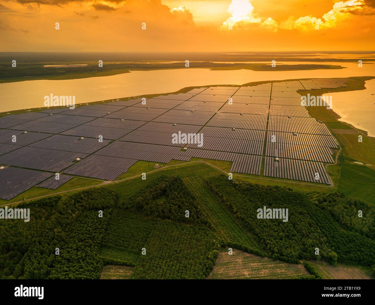 Aerial view of large sustainable electrical power plant with many rows ...