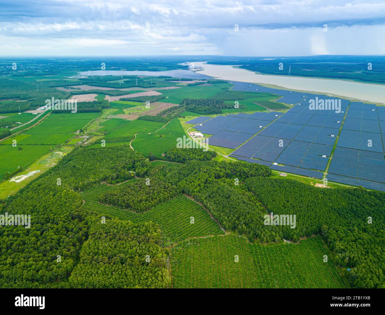 Aerial view of large sustainable electrical power plant with many rows