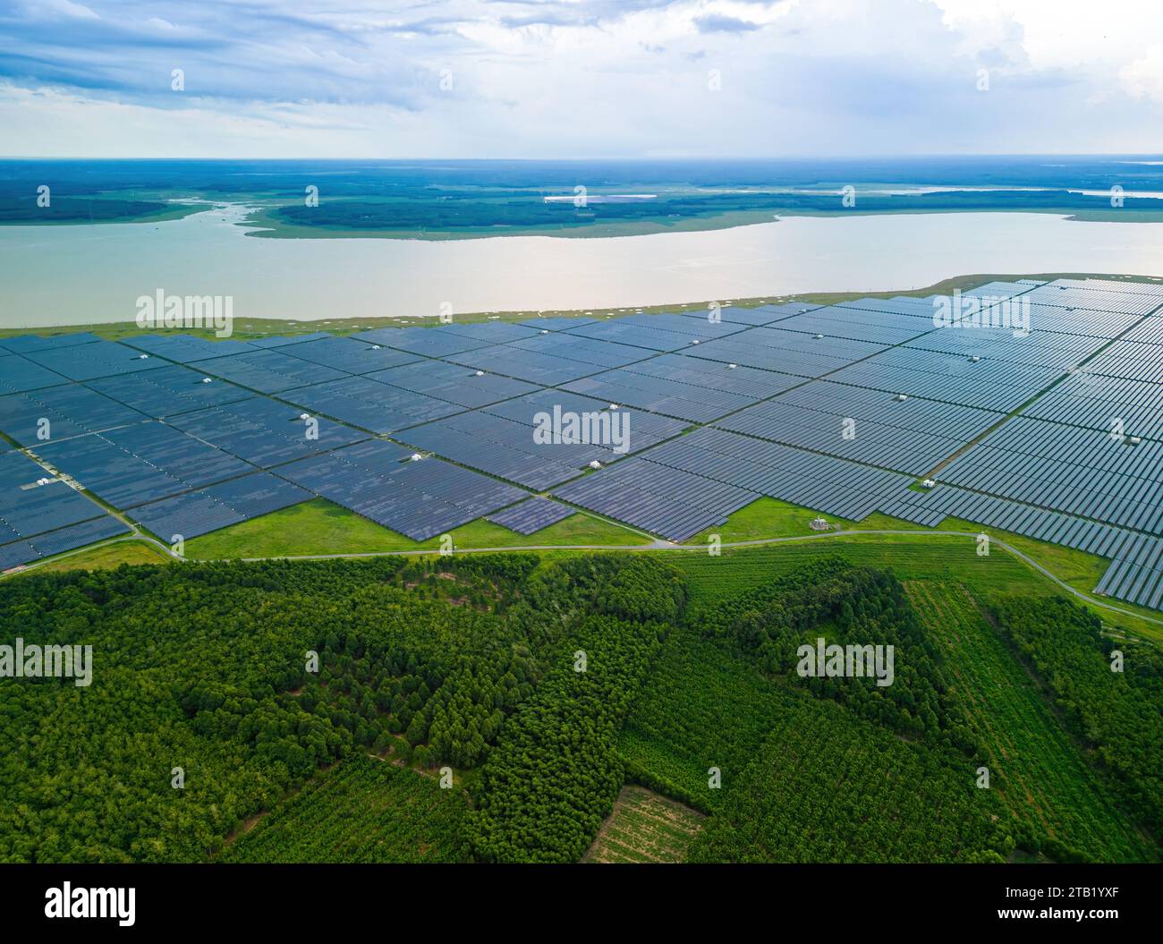 Aerial view of large sustainable electrical power plant with many rows ...