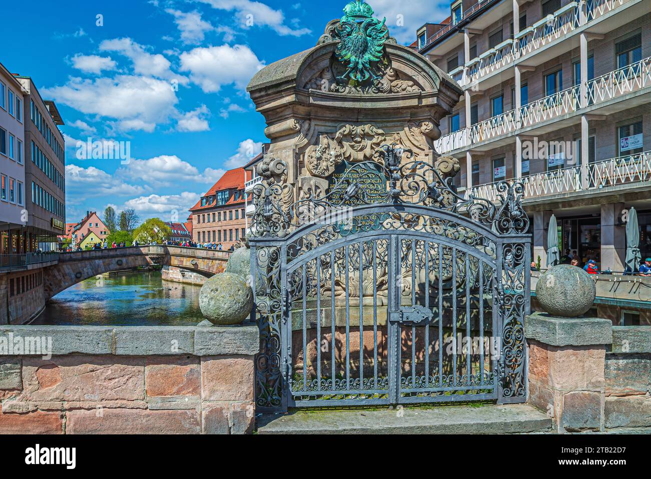 NUREMBERG, BAVARIA, GERMANY - APRIL 30, 2023: View of the Museum Bridge (Museumsbrücke formerly Barfüßerbrücke), a sandstone arch bridge that spans th Stock Photo