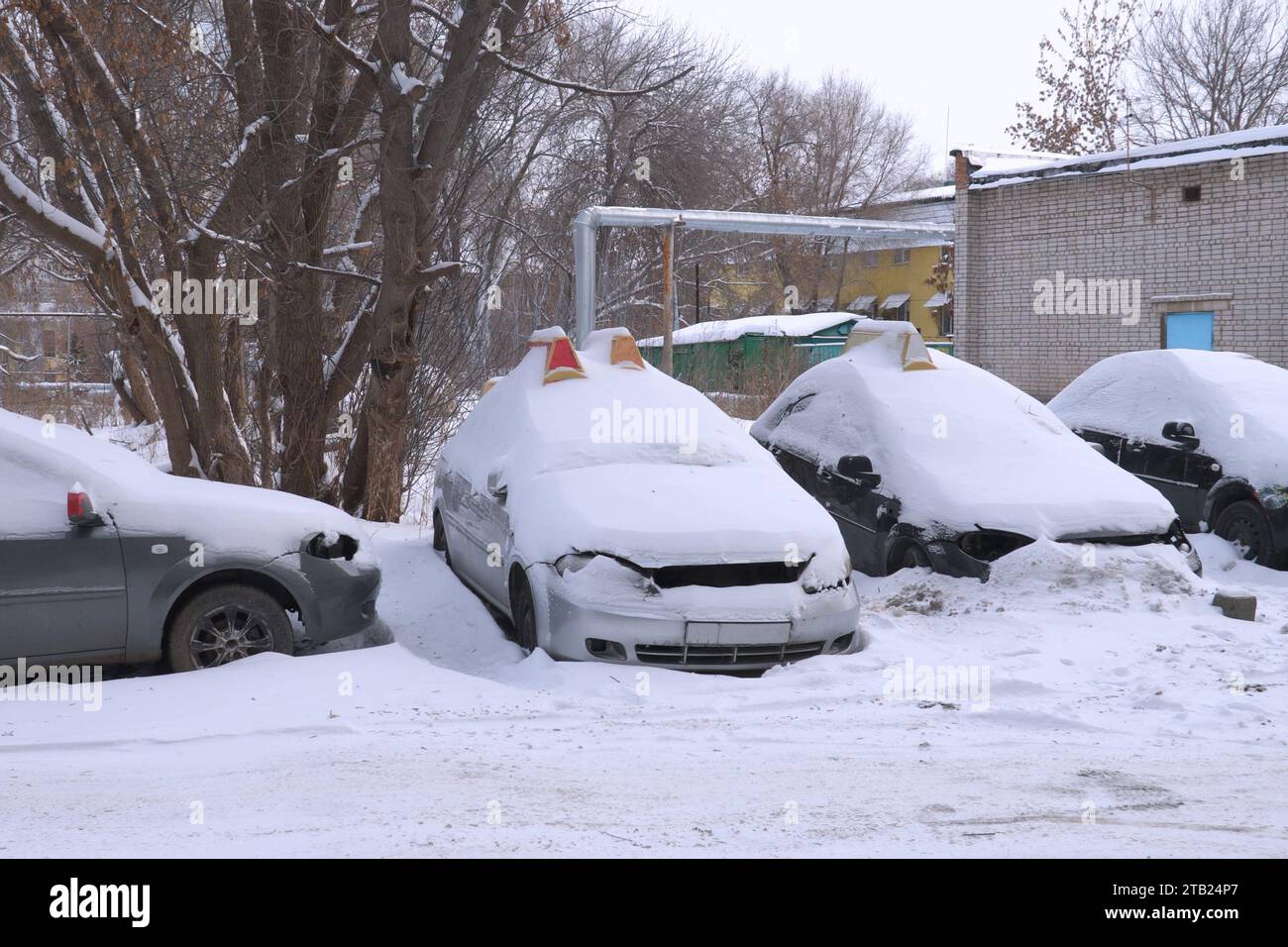 Cars covered with snow in the Parking lot Stock Photo - Alamy
