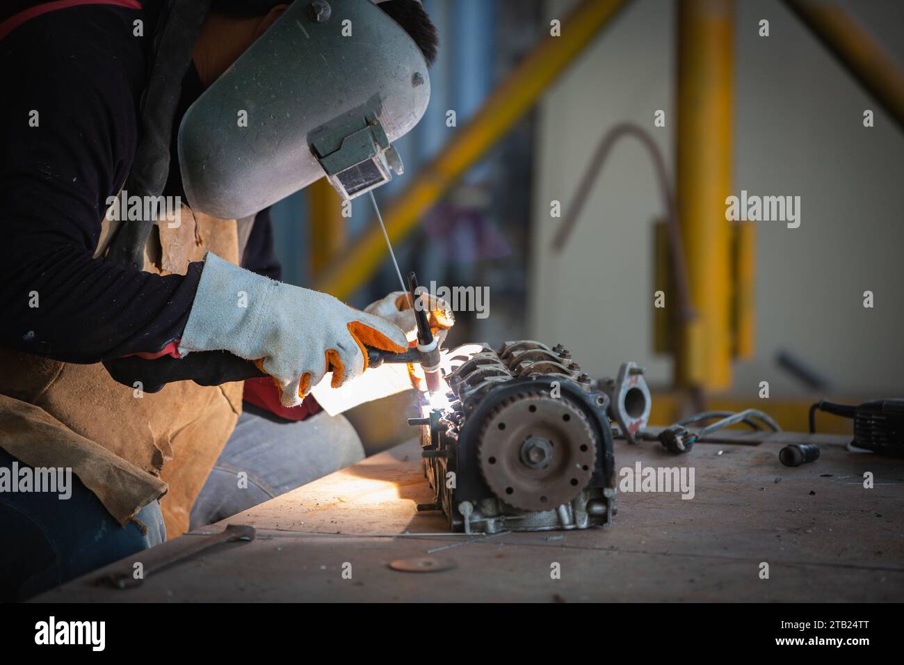 Welder is welding Tungsten Inert Gas welding, Welding aluminum with
