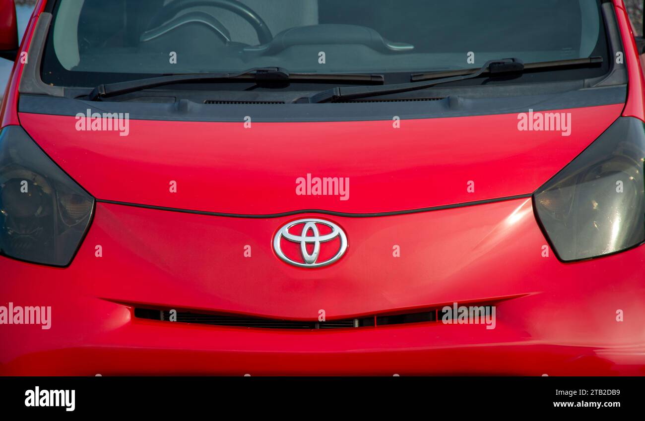 Close up of a red Toyota car with chrome badge, logo. Stock Photo