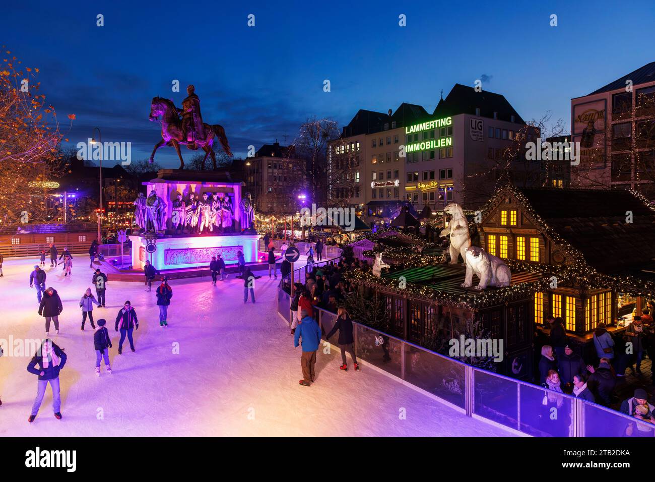 ice skating rink on the Christmas market at the Heumarkt in the historic town, equestrian statue for the Prussian king Friedrich Wilhelm III., Cologne Stock Photo