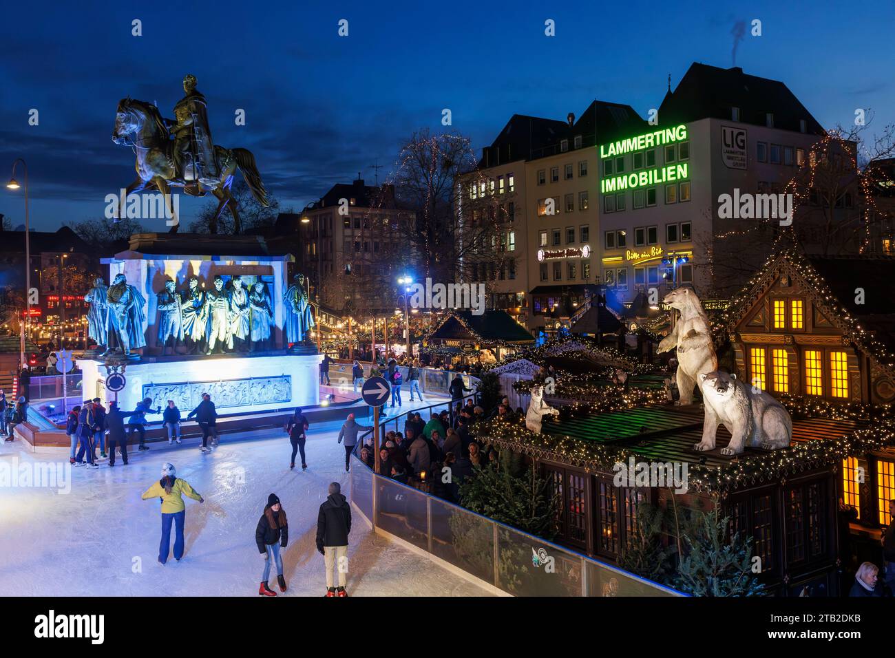 ice skating rink on the Christmas market at the Heumarkt in the historic town, equestrian statue for the Prussian king Friedrich Wilhelm III., Cologne Stock Photo