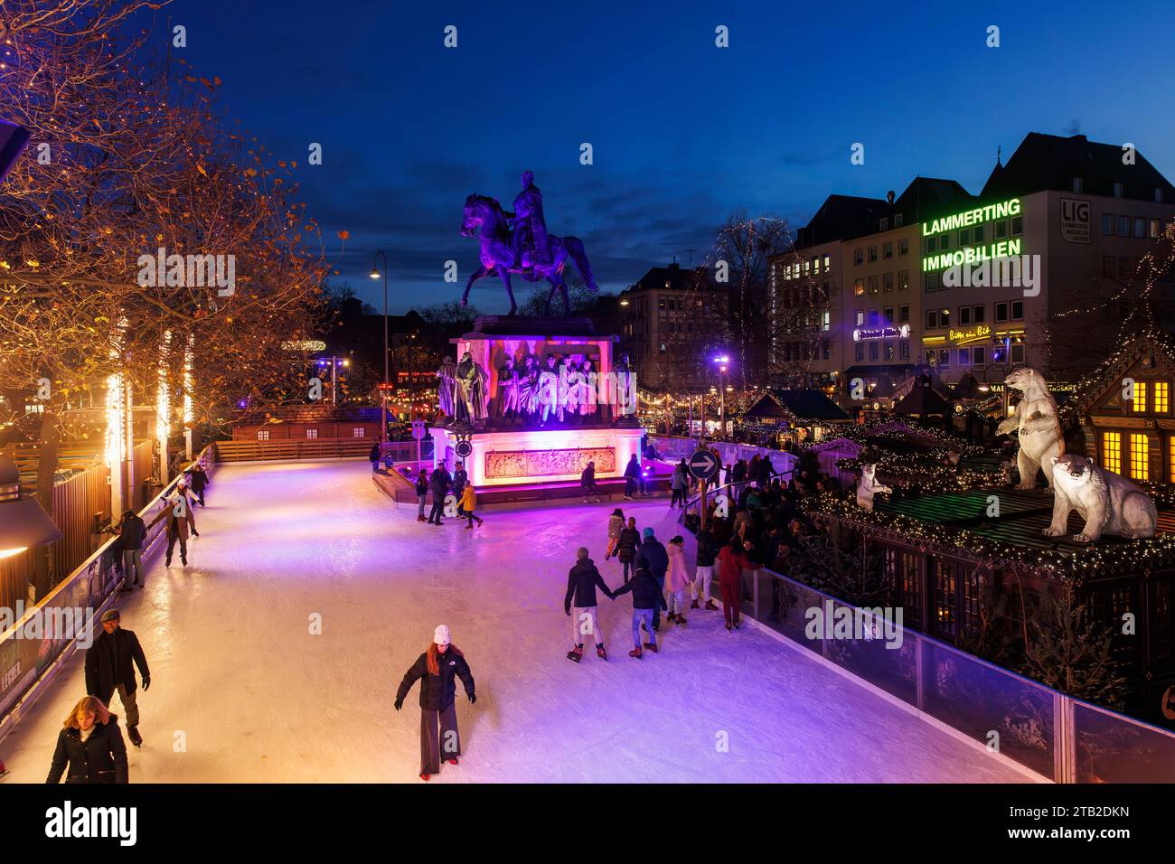 ice skating rink on the Christmas market at the Heumarkt in the historic town, equestrian statue for the Prussian king Friedrich Wilhelm III., Cologne Stock Photo