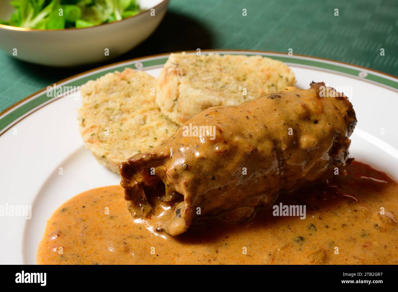 Beef Roulade or Rindsroulade with Semmelknodel Dumpling, Sour Cream Gravy and Salad Stock Photo