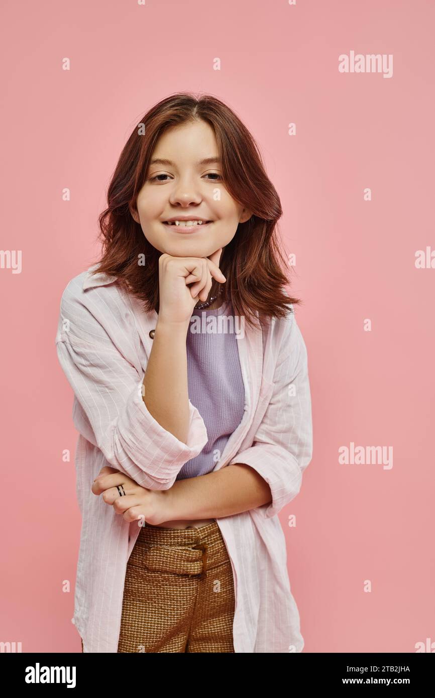 joyful and stylish preteen girl with healthy shiny hair smiling at ...