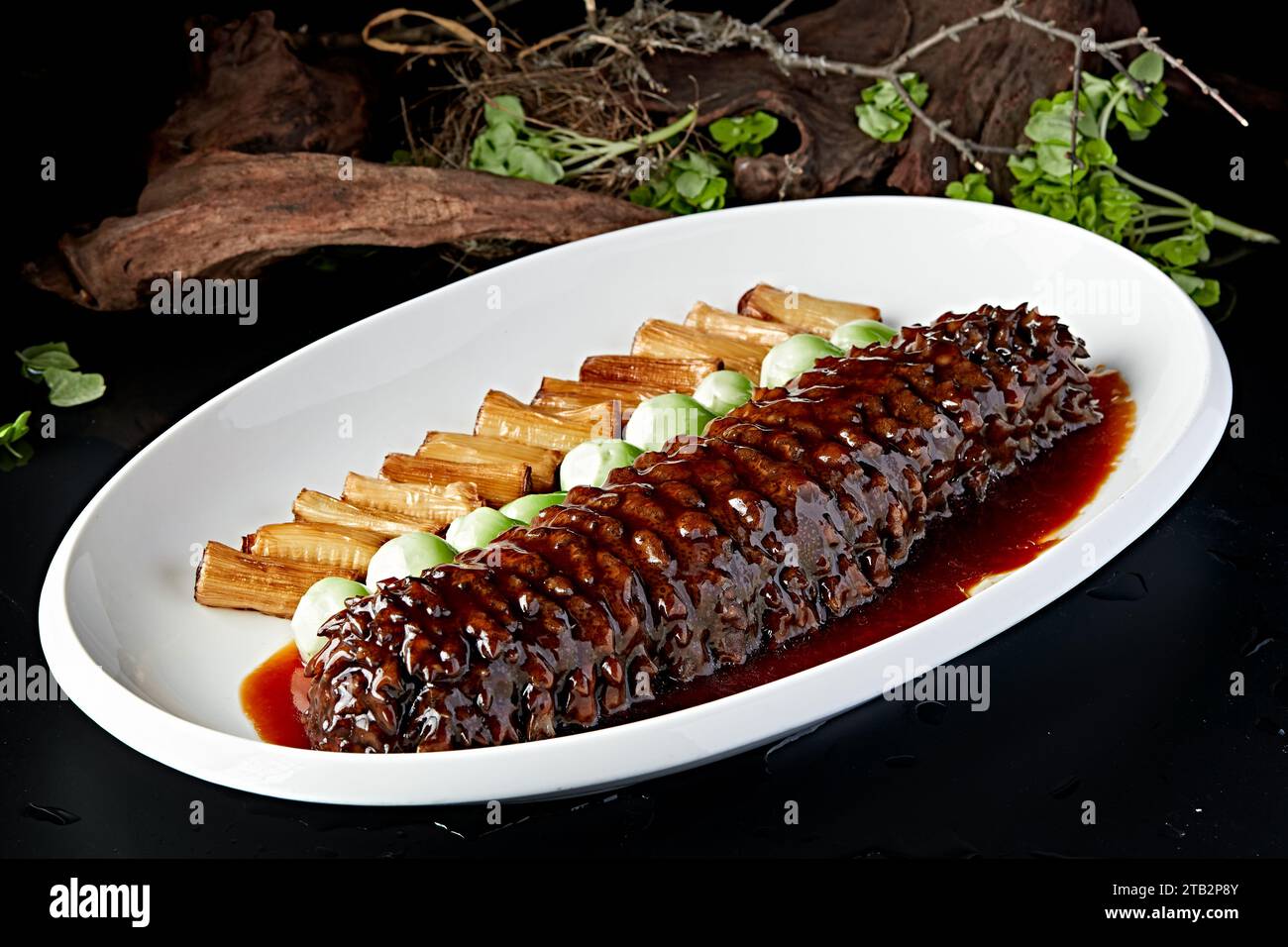 Braised Sea Cucumber With Scallions Recipe Stock Photo Alamy
