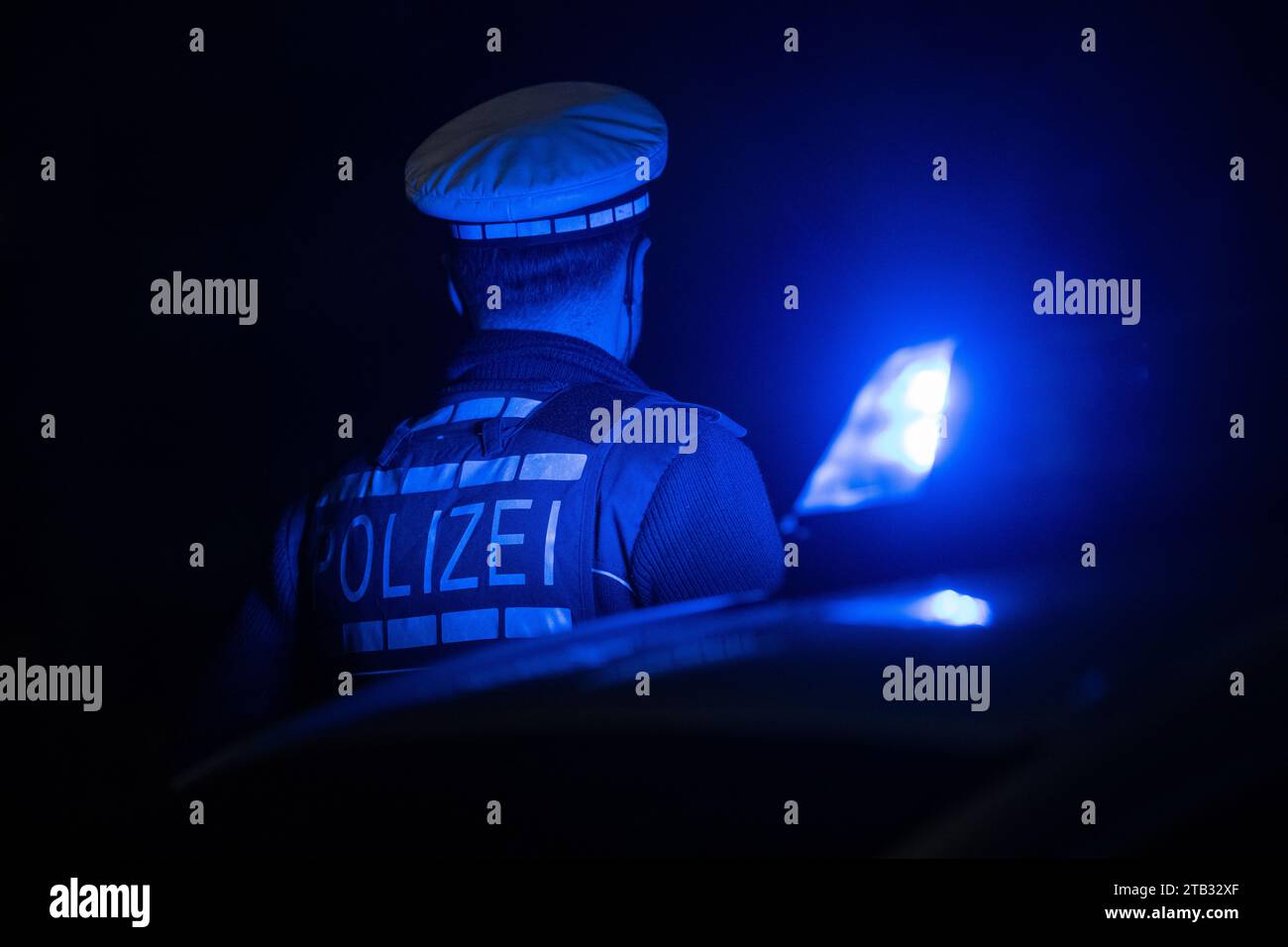 Stuttgart, Germany. 30th Nov, 2023. A police officer stands next to a ...