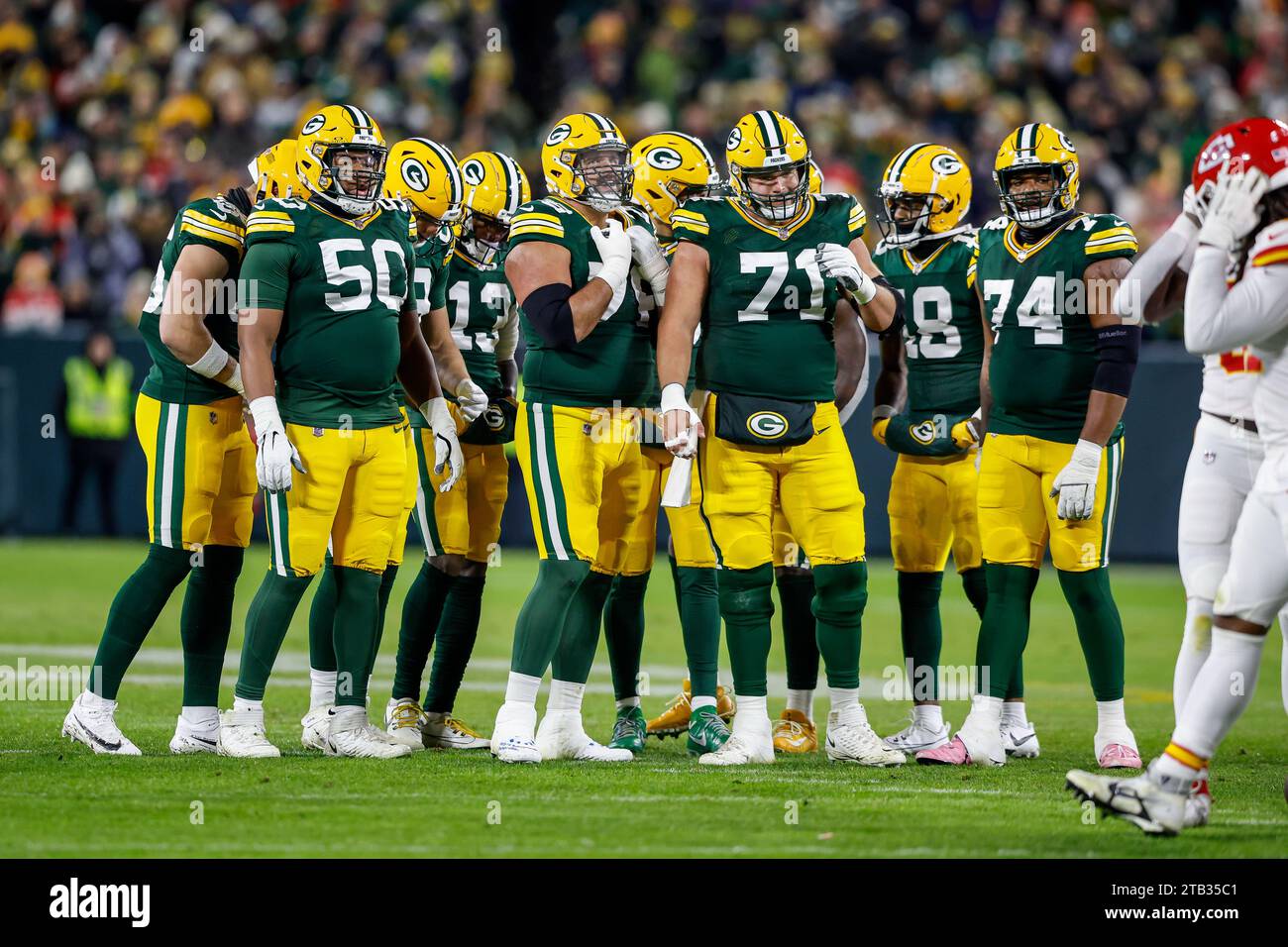 Green Bay, Wisconsin, USA. 3rd Dec, 2023. Green Bay Packers guard Zach Tom (50), guard Jon Runyan (76), center Josh Myers (71), guard Elgton Jenkins (74), and the Packer offense during the NFL football game between the Kansas City Chiefs and the Green Bay Packers at Lambeau Field in Green Bay, Wisconsin. Darren Lee/CSM/Alamy Live News Stock Photo