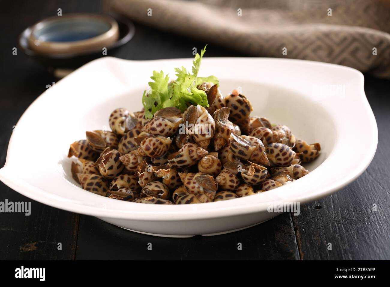 Delicious Chinese food, Sea Snails in Spicy Wine，boiled Sea Snails ，Sea Whelk Stock Photo Alamy