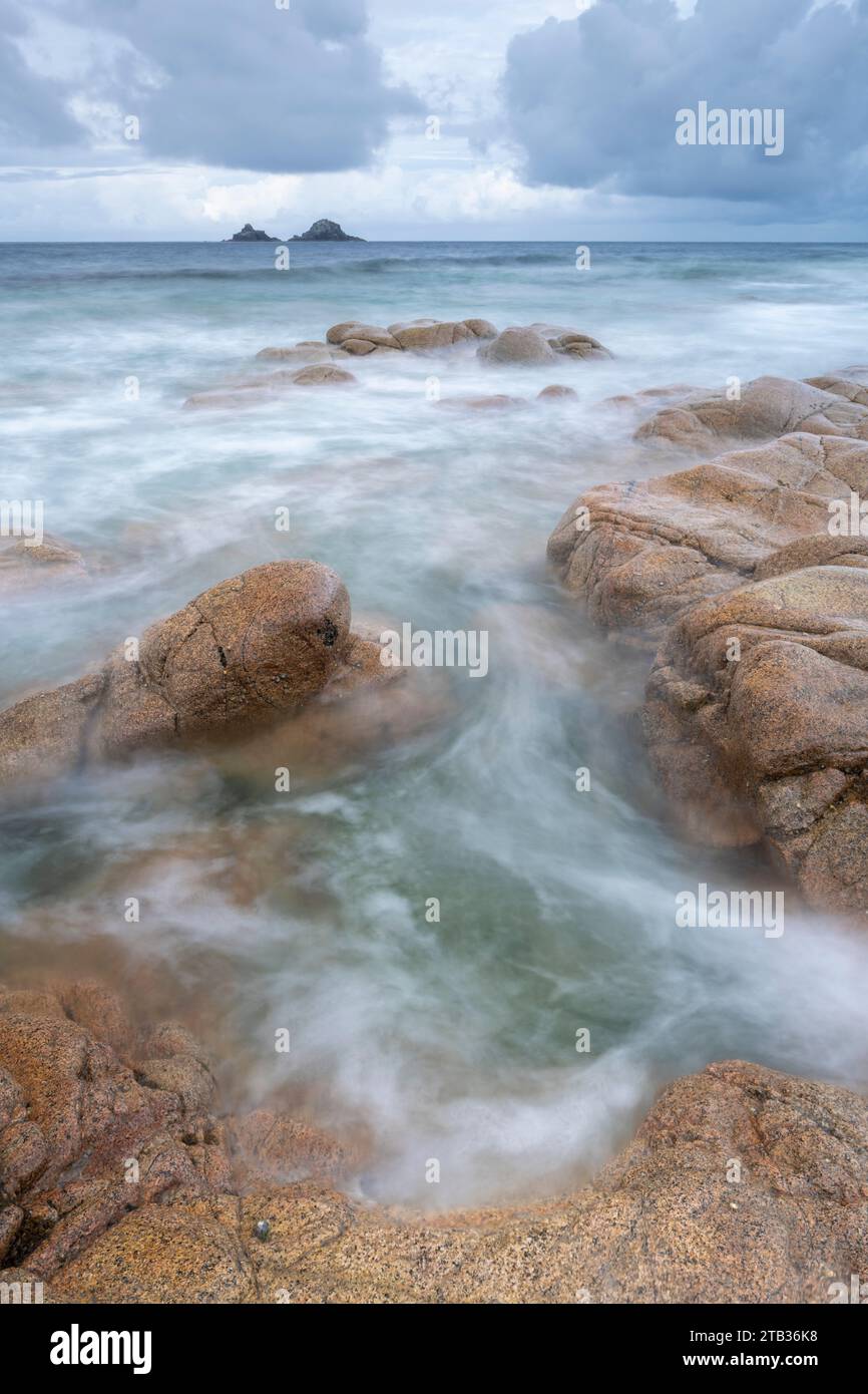 The Brisons islands from the rocky shores of Nanven, near St Just in Cornwall, England.  Spring (May) 2022. Stock Photo