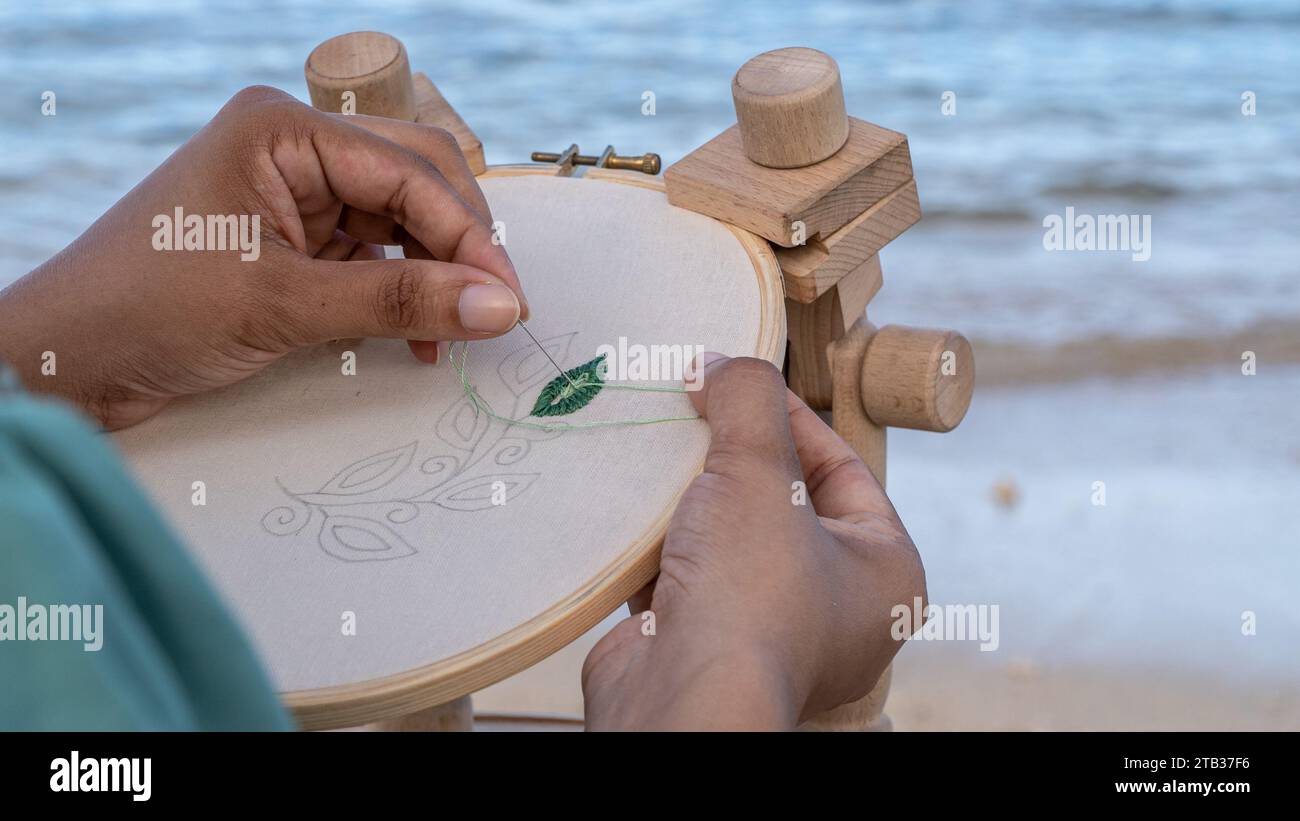 Crafting Elegance: Hand-Sewn Pattern on Cotton Fabric Stock Photo - Alamy