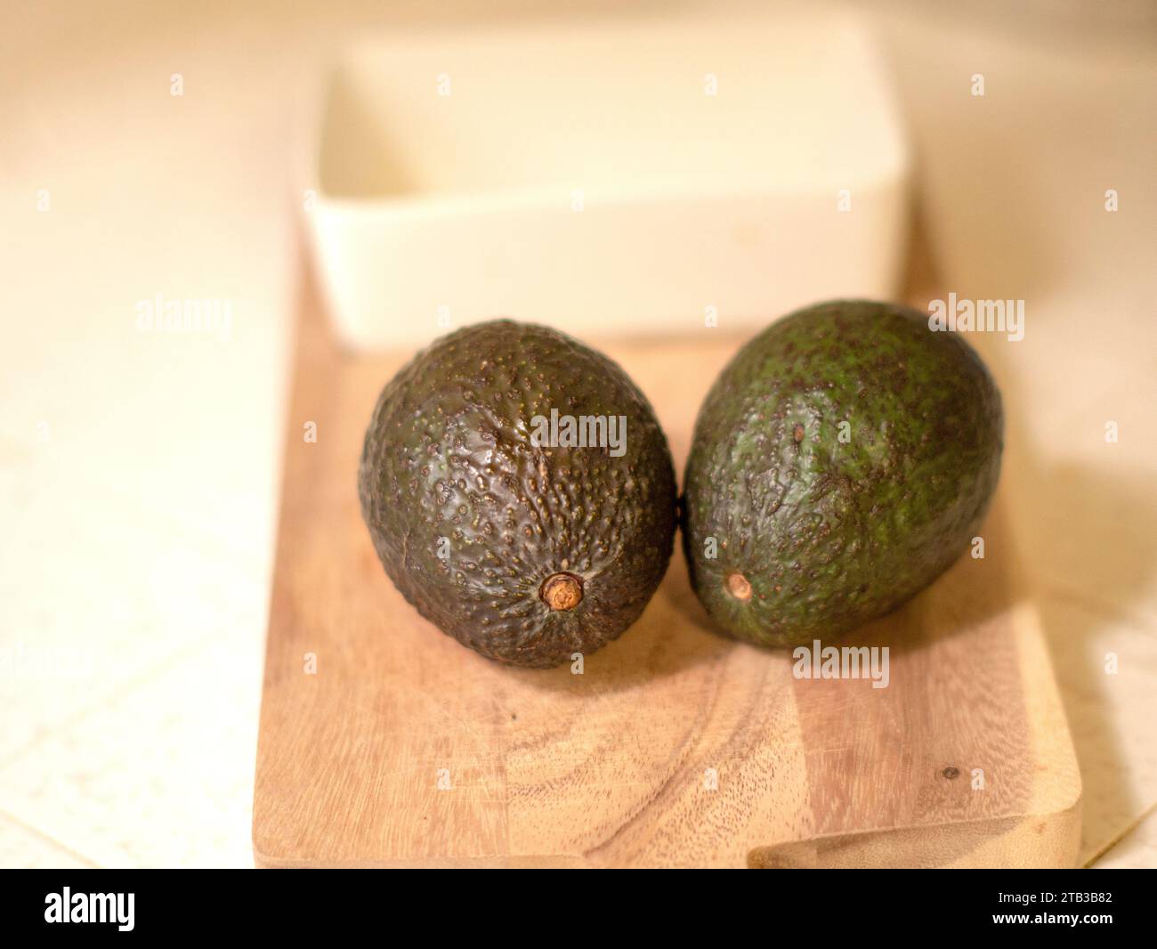 Avocados on the cutting board Stock Photo