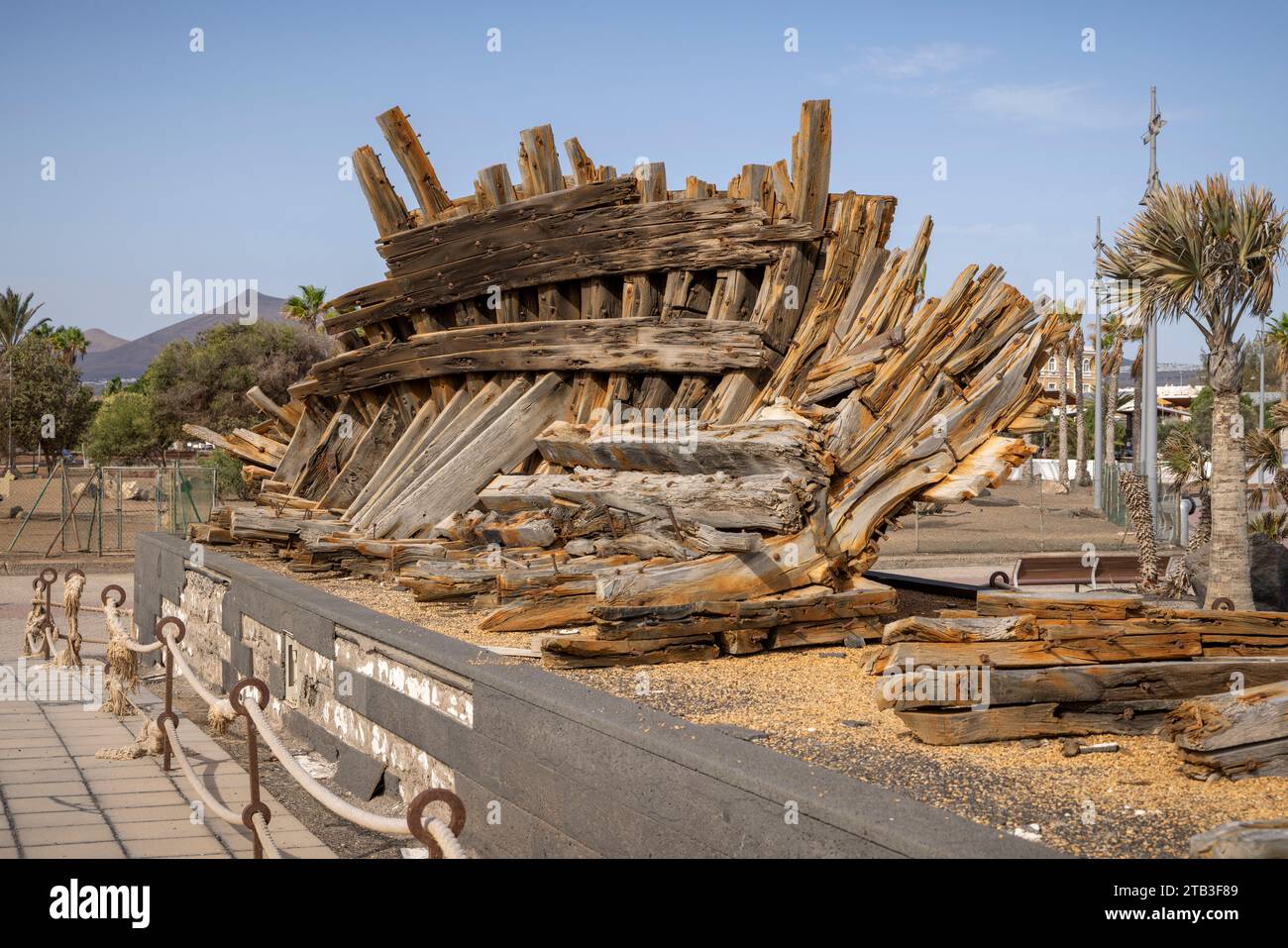 Old wooden ship wreck on display on the Arrecife sea front, Lanzarote, Canary Islands, Spain. Stock Photo