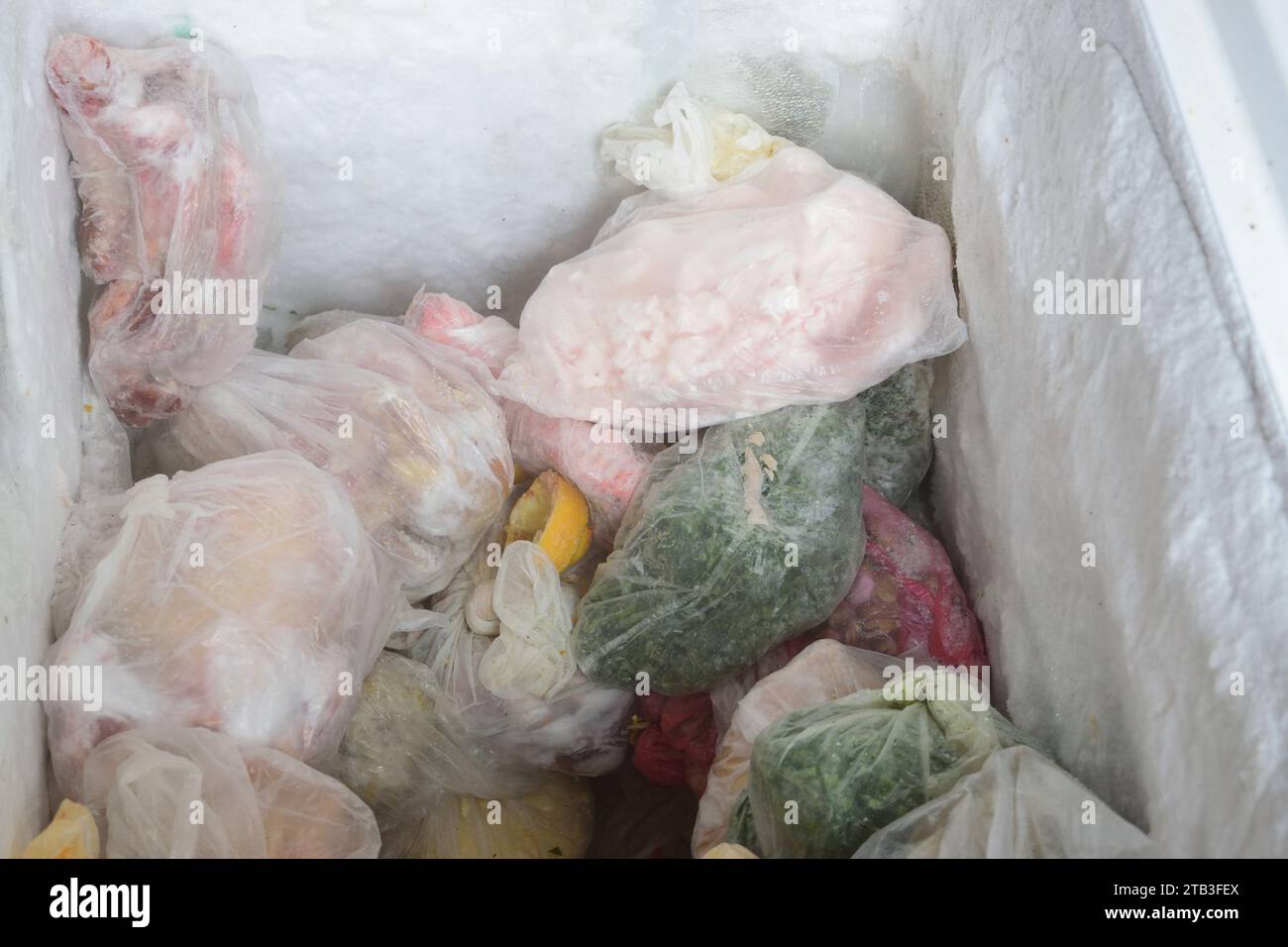stack of food conserved in bad condition in freezer. harmful food for helth Stock Photo