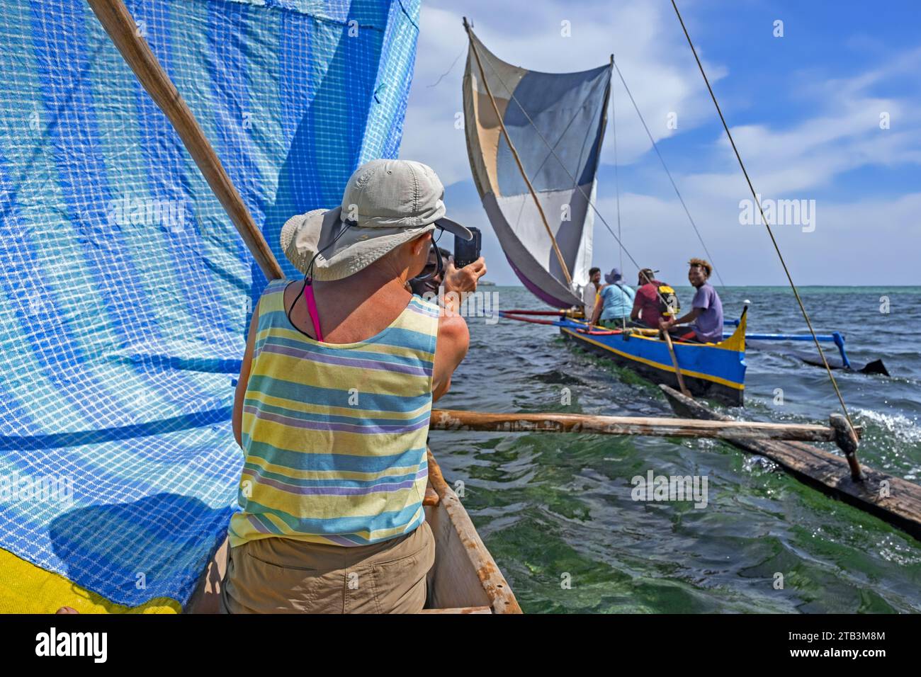 Local fishermen sailing with tourists in traditional fishing boats
