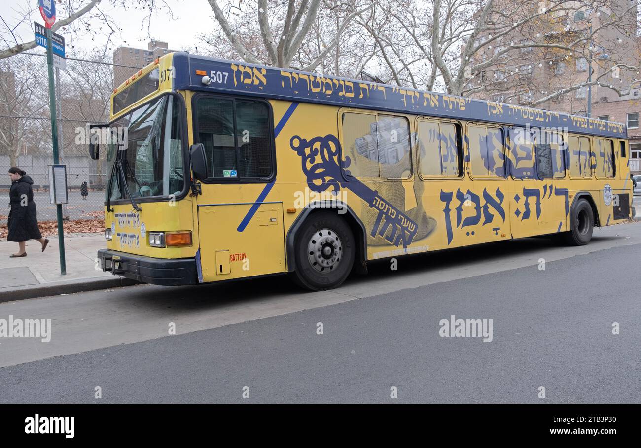 A Bnei Emunim private company bus transporting orthodox Jews from Williamsburg to Borough Park and back. It encourages worshippers to say 'Amen.' Stock Photo