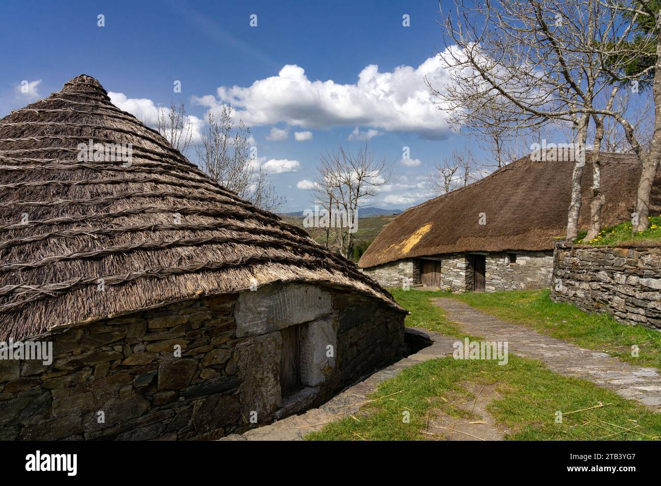 Traditional houses called pallozas with their thatched roofs in the beautiful village of O Cebreiro, which is a cr Stock Photo