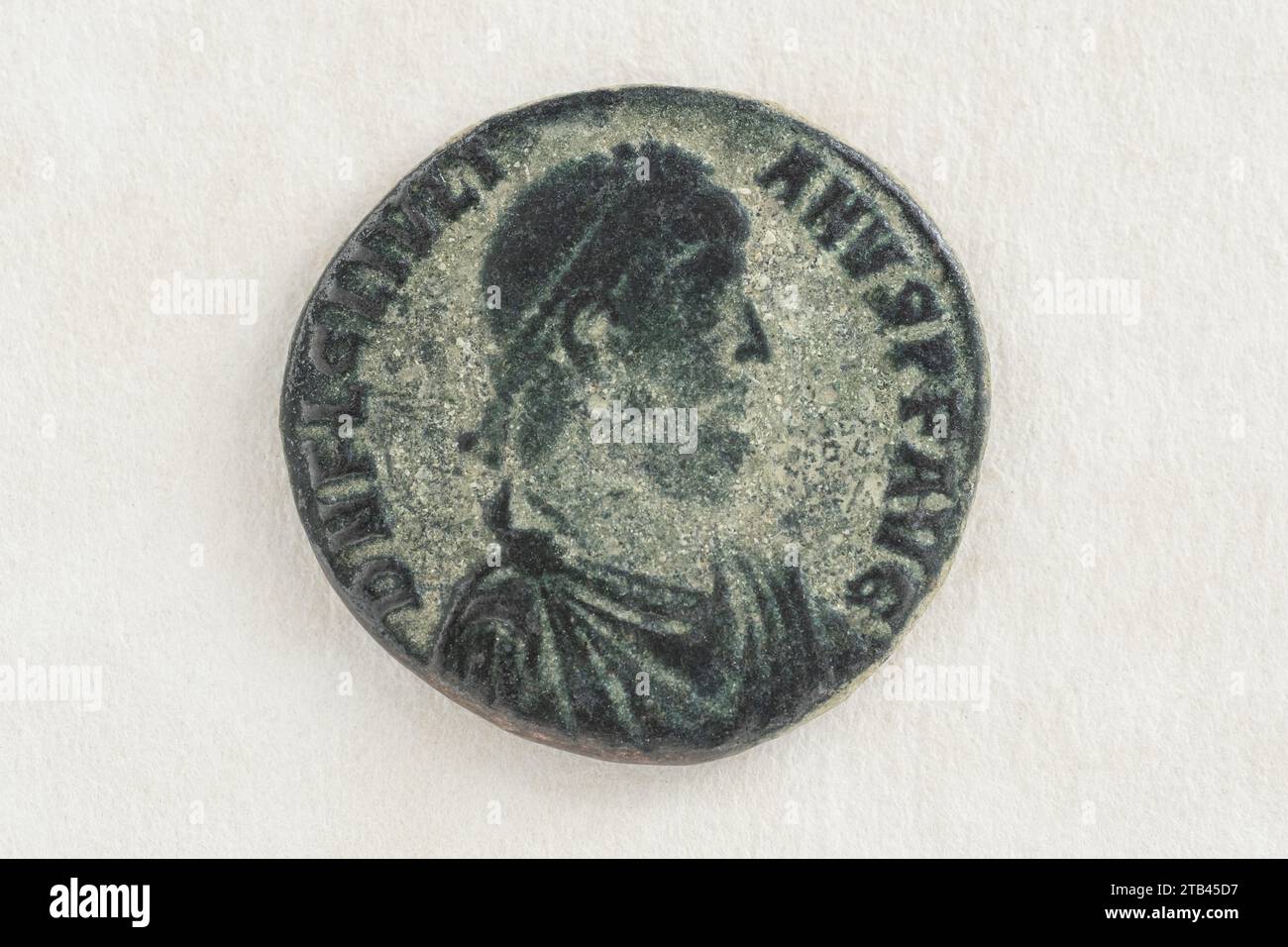 replica of an ANTIQUE Roman Empire AD Bronze Coin. Oxidized Green Reproduction bronze coin from the Roman era. macro.  Roman relic. Stock Photo
