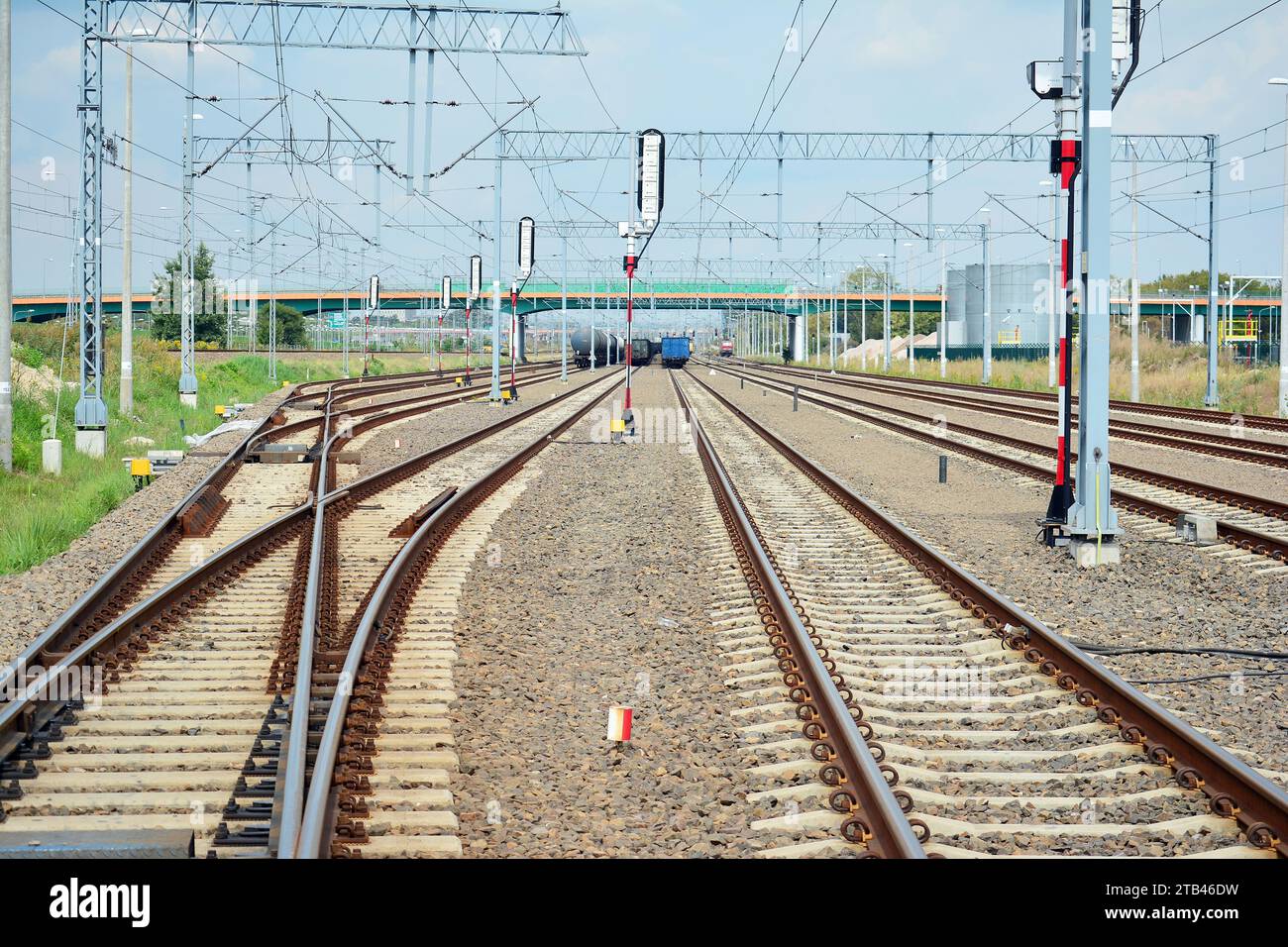 Railroad tracks at a train station Stock Photo