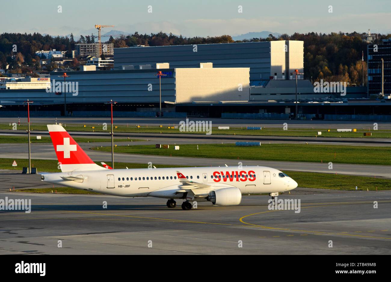 Bombardier CSeries CS100 aircraft of the airline Swiss International Air Lines taxiing to the runway, Zurich Airport, Zurich, Switzerland Stock Photo