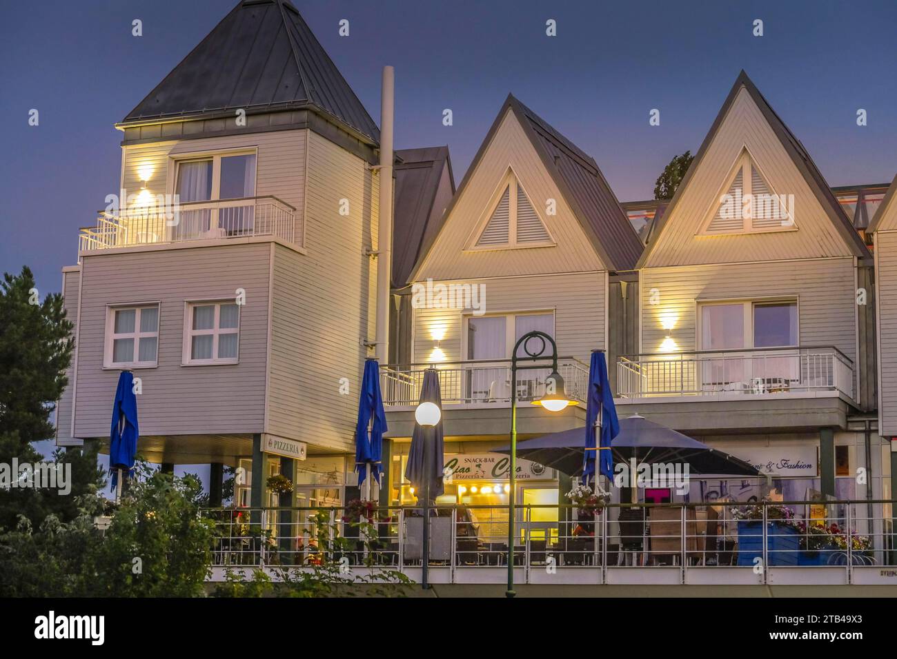 Building complex with holiday flats, shops, Heringsdorf pier, Usedom, Mecklenburg-Western Pomerania, Germany Stock Photo