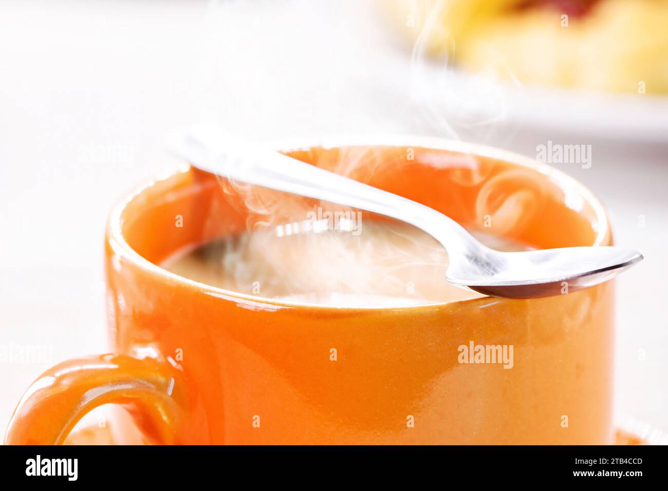 typical brazilian latte cup, drink served hot, steam and smoke coming
