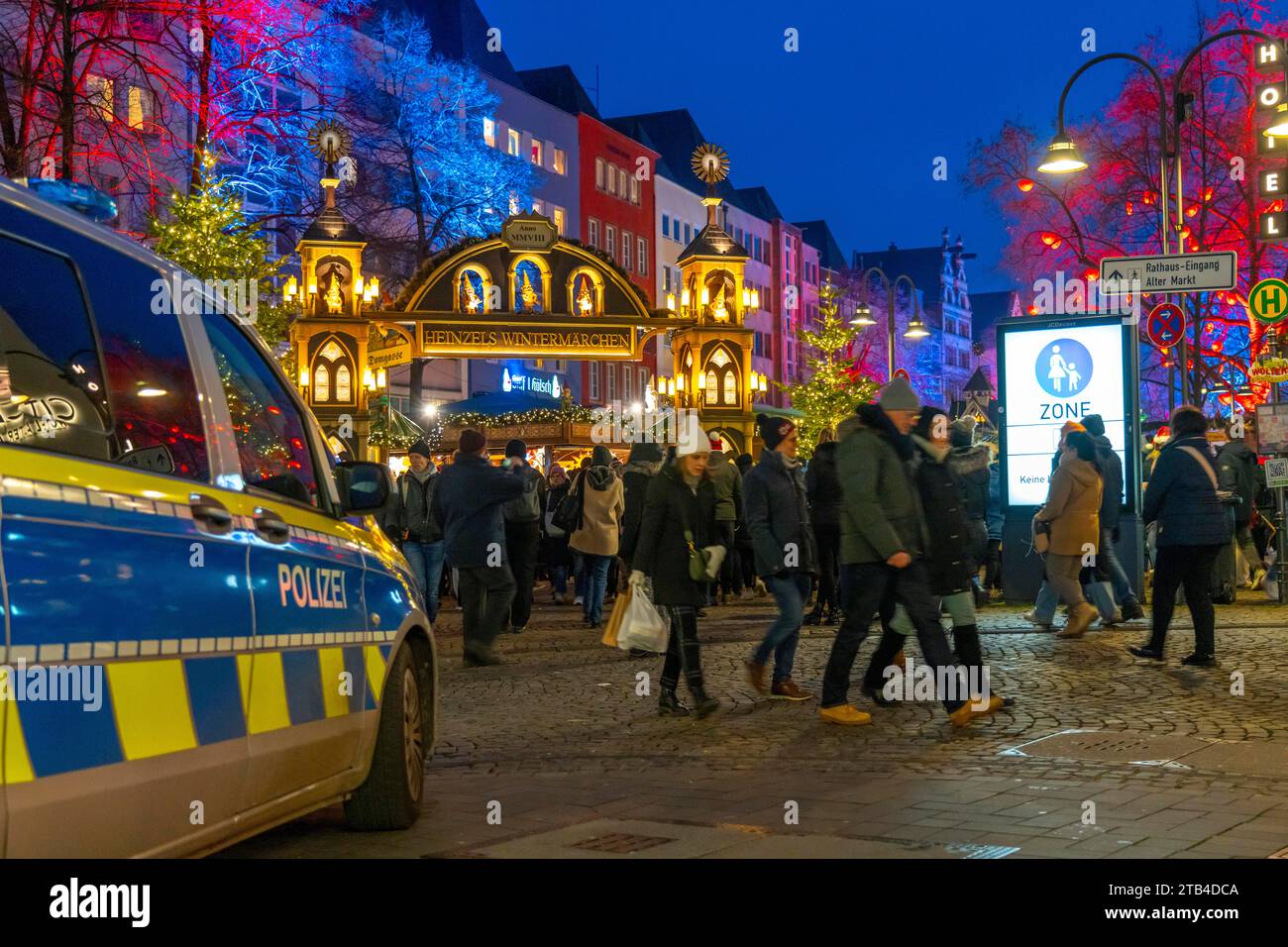 Police patrol car in front of the Christmas market on the Alter Markt in the old town of Cologne, Sunday shopping in Cologne city centre, 1st Advent w Stock Photo