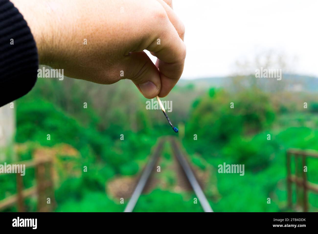 Matches on rails railroad tracks background, fire on railways concept