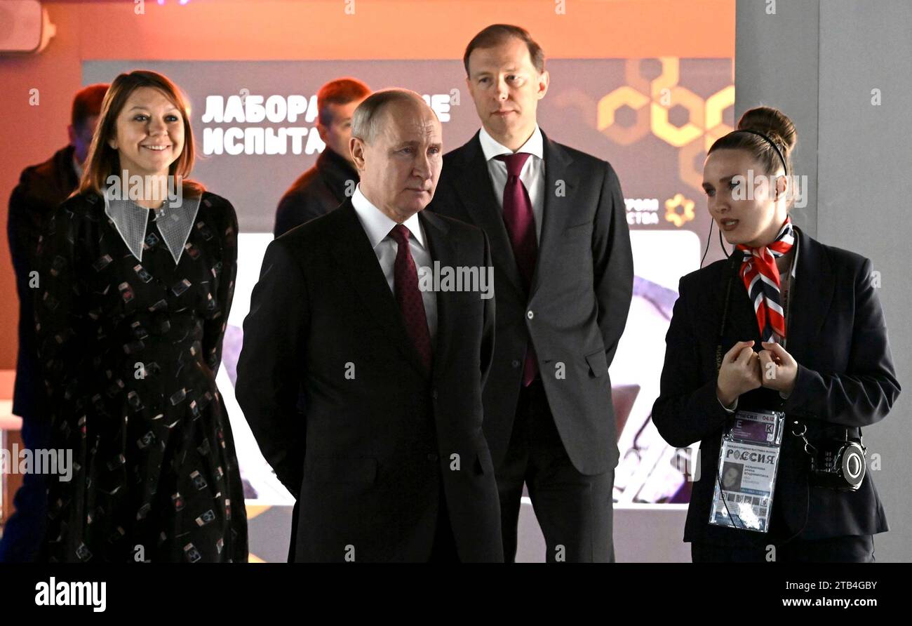Moscow, Russia. 04th Dec, 2023. Russian President Vladimir Putin, 2nd left, accompanied by Minister of Industry and Trade Denis Manturov, 2nd right, and Director General of the Exhibition of Achievements Natalia Virtuozova, left, visit the Exhibition of Achievements of National Economy, December 4, 2023 in Moscow, Russia. Credit: Russian Presidency/Kremlin Pool/Alamy Live News Stock Photo