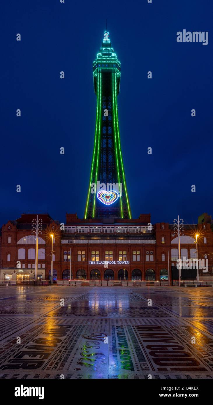 Blackpool Tower, sea front, beach  and promenade at night with illuminations and neon lights. Blackpool holiday resort in Lancashire England. Stock Photo