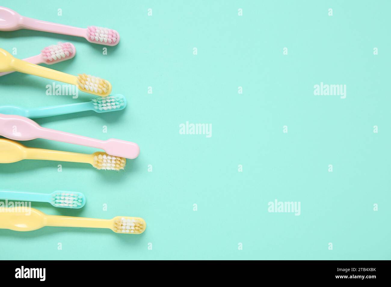 Colorful plastic toothbrushes on color background Stock Photo - Alamy