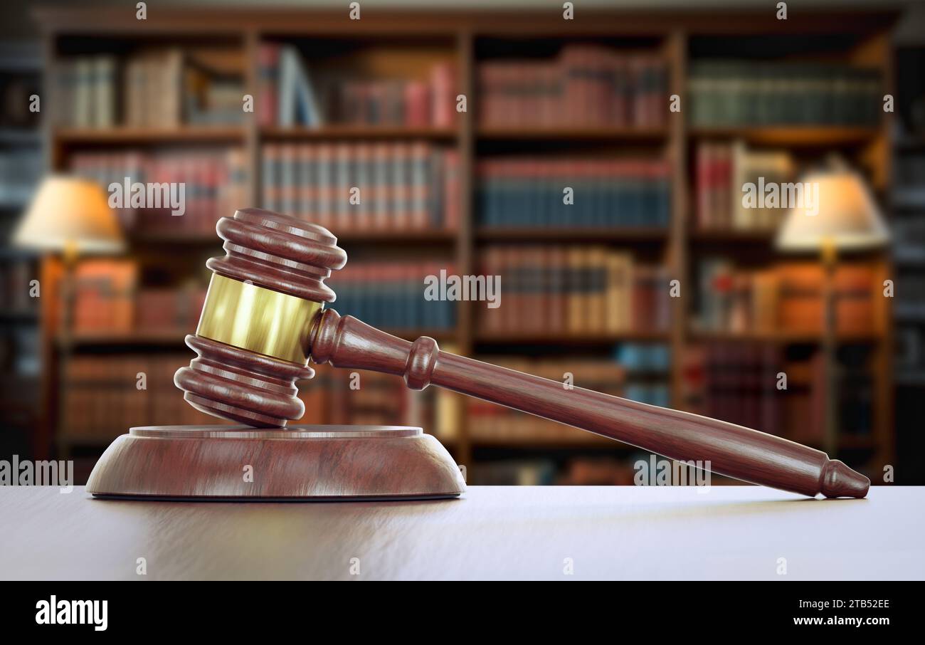 Gavel Resting on a Table Inside a Law Office with Bookshelf of Law