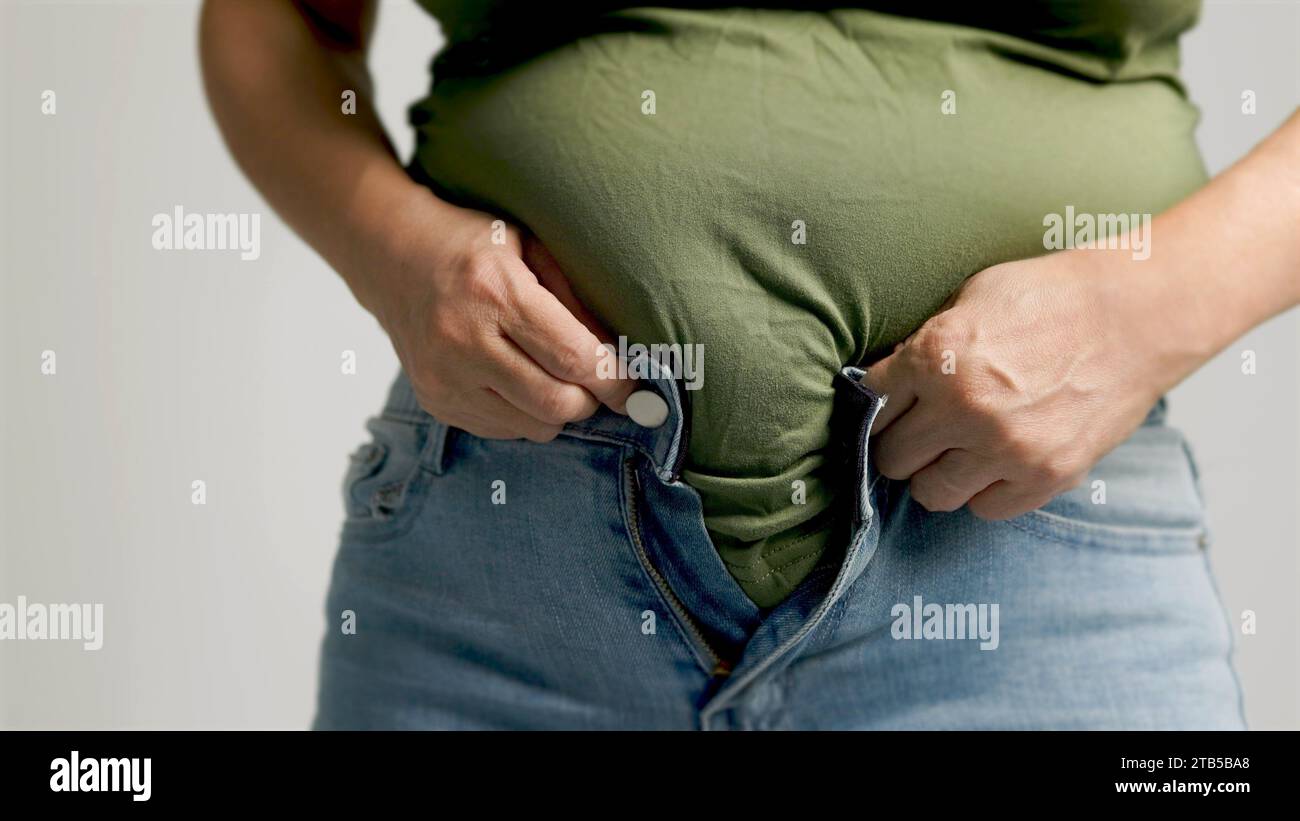 Fat woman zip trousers hi-res stock photography and images - Alamy