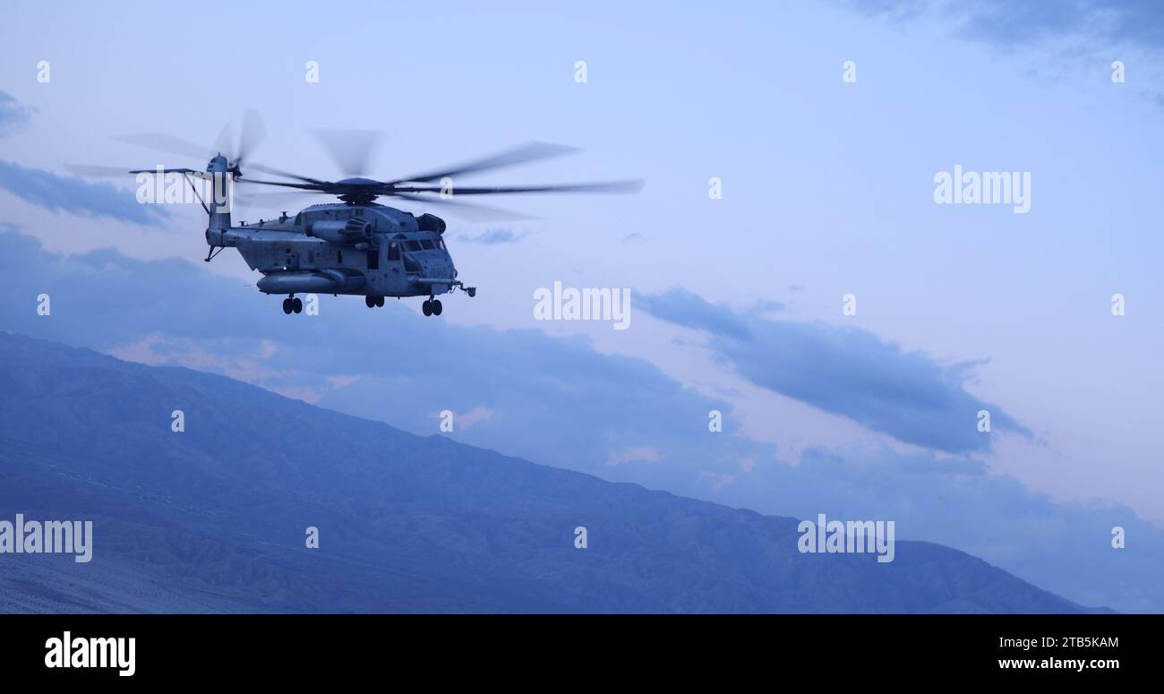 A U.S. Marine Corps CH-53E Super Stallion with Marine Heavy Helicopter Squadron (HMH) 361, Marine Aircraft Group 16, 3rd Marine Aircraft Wing, conducts flight maneuvers during Exercise Steel Knight 23.2 over Palm Springs, California, Nov. 30, 2023. Steel Knight 23.2 is a three-phase exercise designed to train I Marine Expeditionary Force in the planning, deployment and command and control of a joint force against a peer or near-peer adversary combat force and enhance existing live-fire and maneuver capabilities of the Marine Air-Ground Task Force. (U.S. Marine Corps photo by Lance Cpl. Samanth Stock Photo