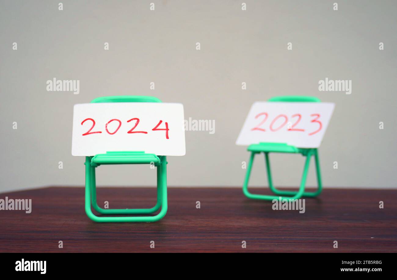 2024 And 2023 Cards On Mini Chairs Change Of Year From 2023 To 2024