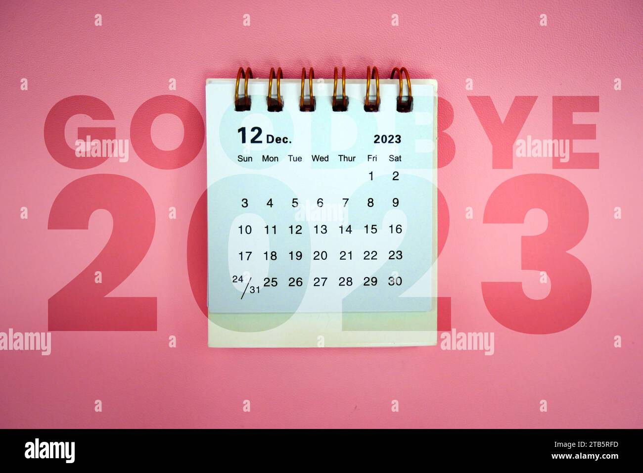 Bye, bye 2023. December 2023 Monthly desk calendar for 2023 year on pink background. Stock Photo