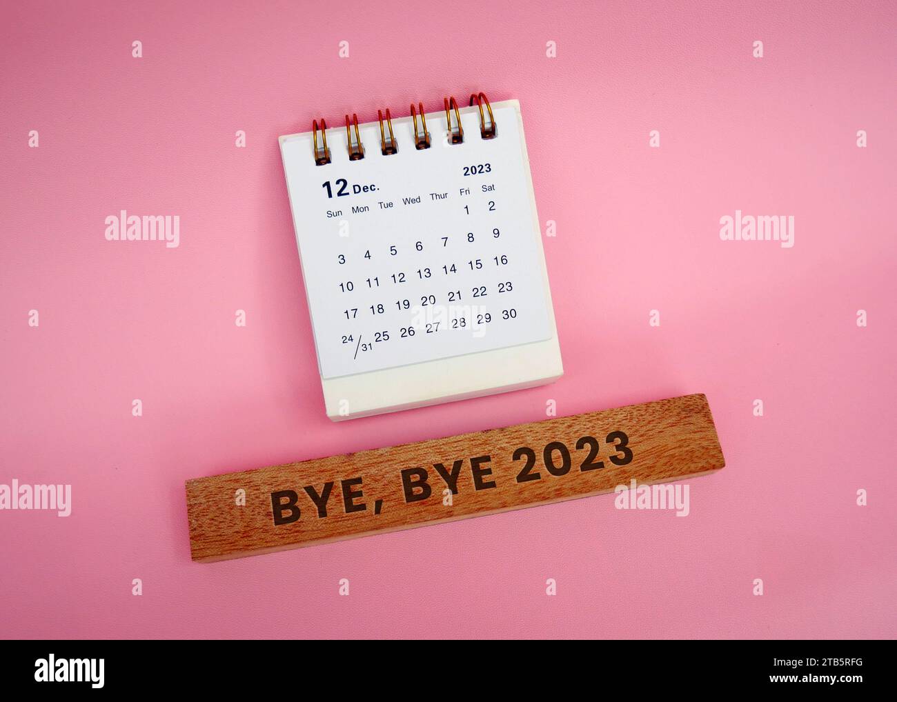 Bye, bye 2023. December 2023 Monthly desk calendar for 2023 year on pink background. Stock Photo