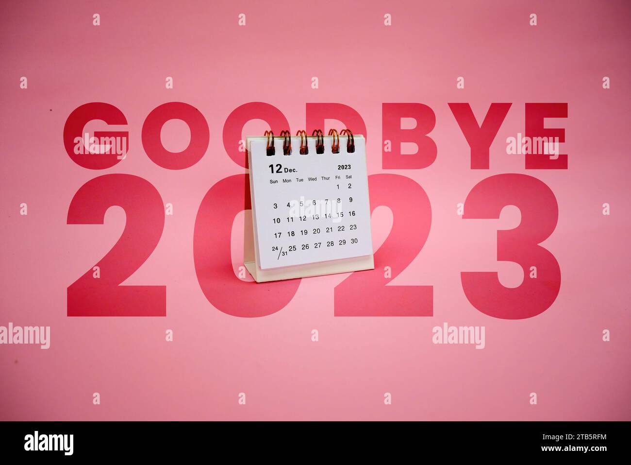 Bye, bye 2023. December 2023 Monthly desk calendar for 2023 year on pink background. Stock Photo