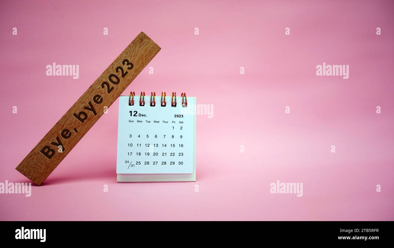 Bye, bye 2023. December 2023 Monthly desk calendar for 2023 year on pink background. Stock Photo