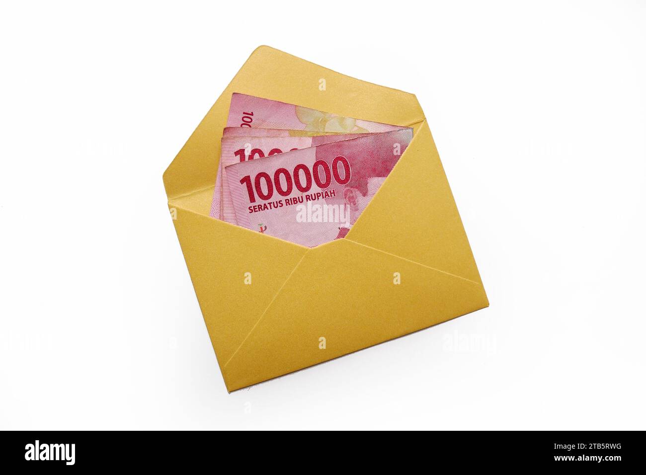 Money in an envelope on a white background. Rupiah is the currency of Indonesia Stock Photo